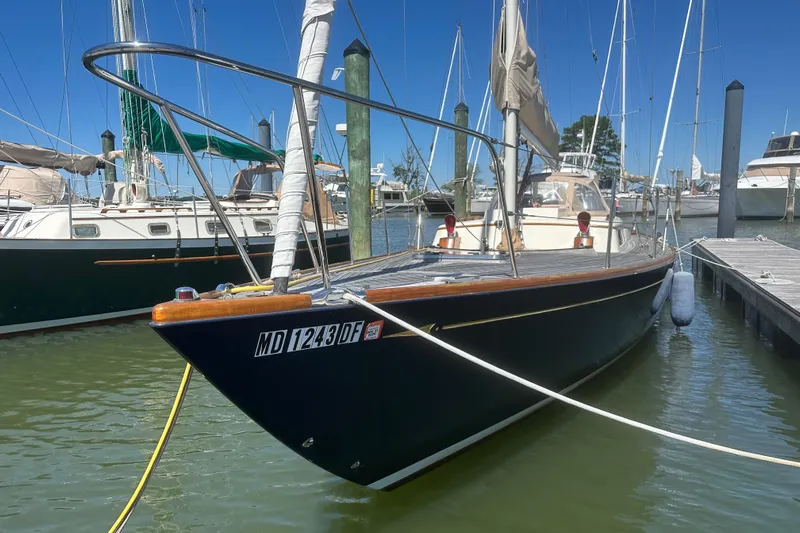 Ibis Yacht Photos Pics Sailboat docked in marina, Morris M36, 2006 model, clear blue sky.