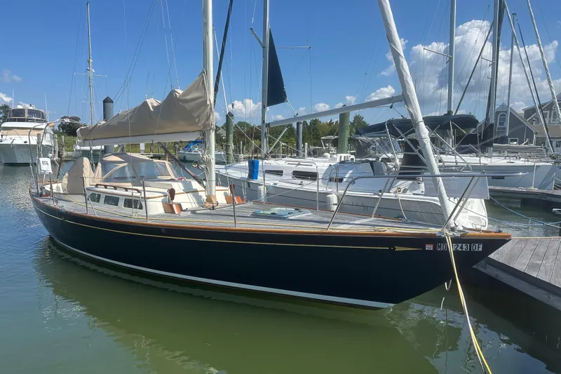Ibis Yacht Photos Pics 2006 Morris M36 sailboat docked at a marina under a clear blue sky.