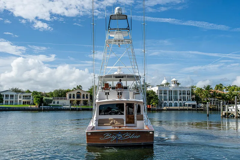 Big Blue Yacht Photos Pics 2007 Viking 64 Convertible yacht on a scenic waterfront with luxury homes.