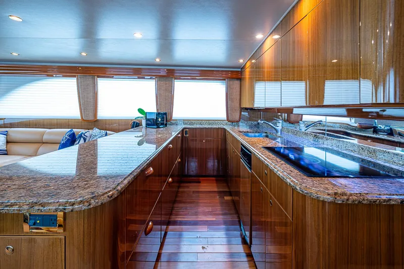 Big Blue Yacht Photos Pics Luxurious kitchen interior of 2007 Viking 64 Convertible yacht with granite countertops.
