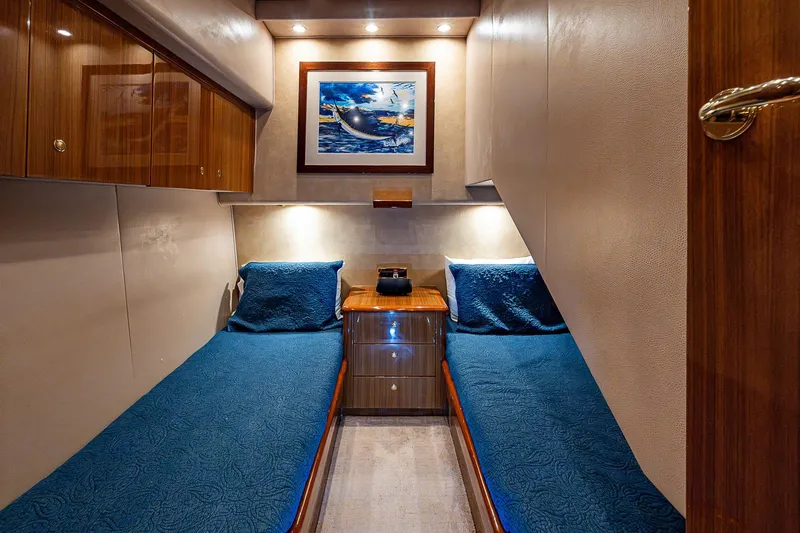 Big Blue Yacht Photos Pics Luxurious 2007 Viking 64 Convertible yacht cabin with twin beds and elegant decor.