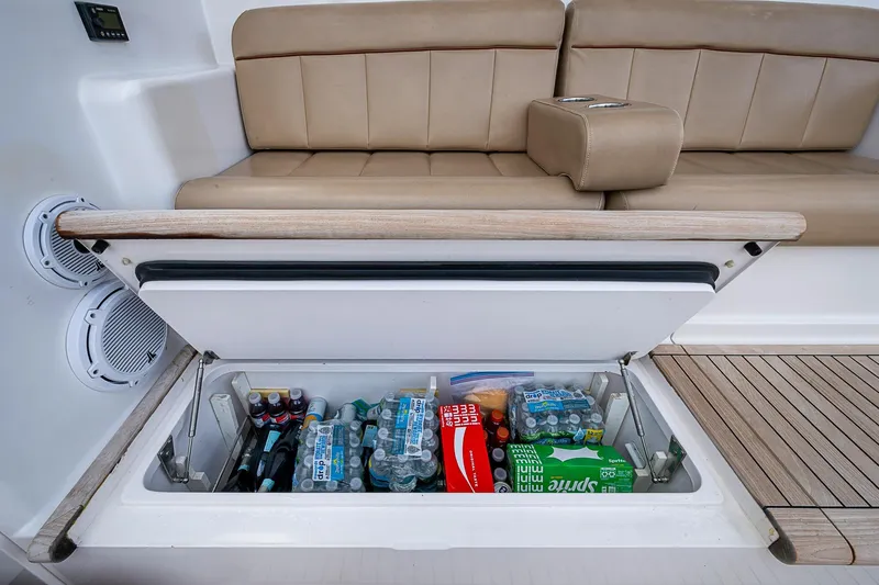 Big Blue Yacht Photos Pics Built-in cooler on 2007 Viking 64 Convertible yacht, stocked with drinks and snacks.