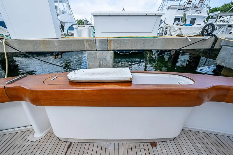 Big Blue Yacht Photos Pics 2007 Viking 64 Convertible yacht with wooden deck detail at marina.