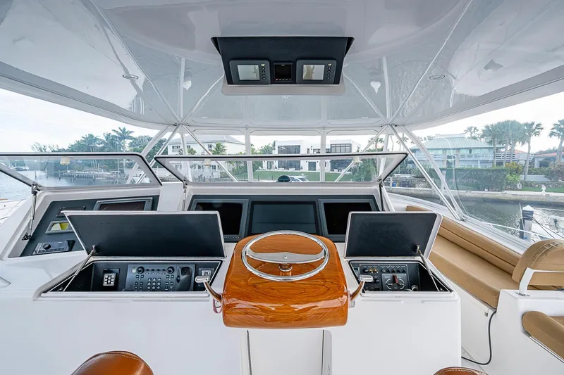 Big Blue Yacht Photos Pics 2007 Viking 64 Convertible yacht helm with advanced navigation controls and luxurious seating.