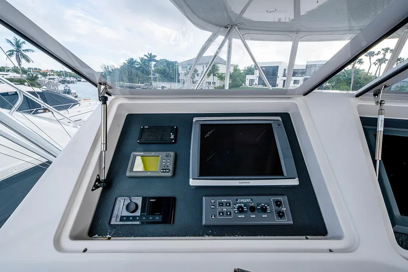 Big Blue Yacht Photos Pics 2007 Viking 64 Convertible yacht helm with navigation equipment and controls.