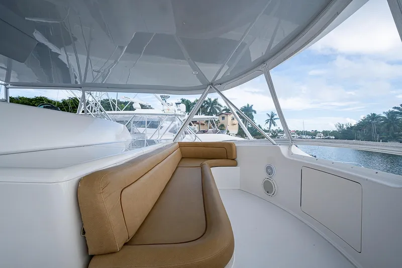 Big Blue Yacht Photos Pics 2007 Viking 64 Convertible yacht interior with tan seating and waterfront view.