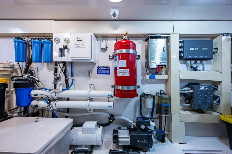 Big Blue Yacht Photos Pics Engine room of 2007 Viking 64 Convertible yacht with fire extinguisher and filtration systems.