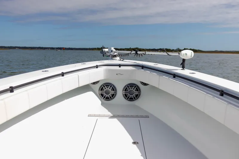  Yacht Photos Pics 2020 Contender 39 ST boat deck with speakers, on calm water under blue sky.