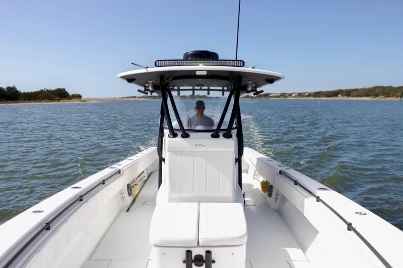  Yacht Photos Pics 2020 Contender 39 ST boat cruising on open water, clear sky, scenic background.