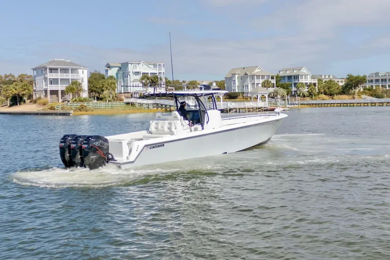  Yacht Photos Pics 2020 Contender 39 ST boat cruising near waterfront homes.