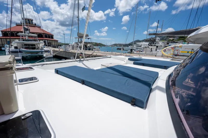  Yacht Photos Pics 2020 Fountaine Pajot SABA 50 catamaran docked at a marina under a bright blue sky.