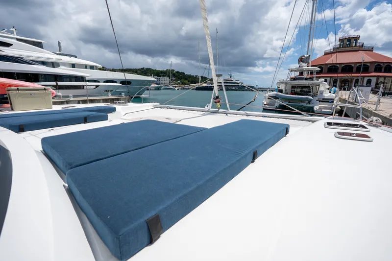  Yacht Photos Pics 2020 Fountaine Pajot SABA 50 catamaran with blue deck cushions docked at marina.