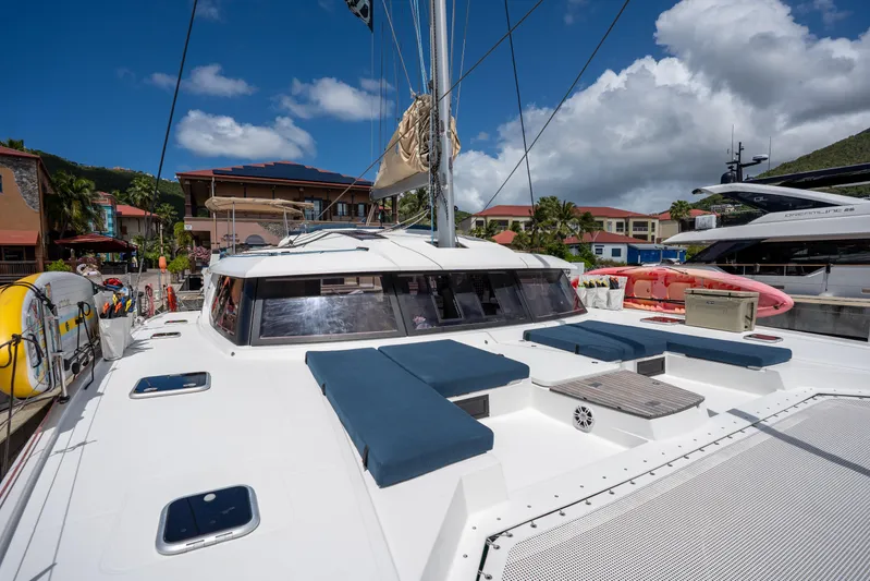  Yacht Photos Pics 2020 Fountaine Pajot SABA 50 catamaran docked, featuring spacious deck and seating under clear skies.