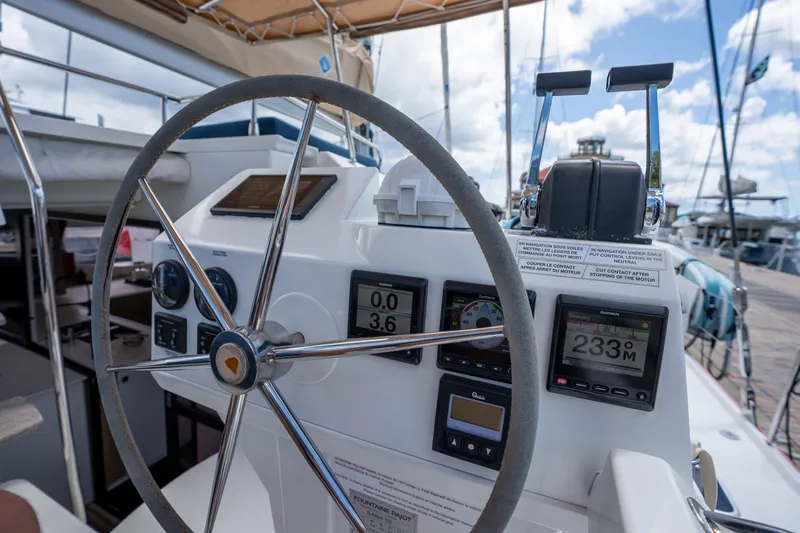  Yacht Photos Pics Helm of 2020 Fountaine Pajot SABA 50 catamaran with navigation instruments and steering wheel.