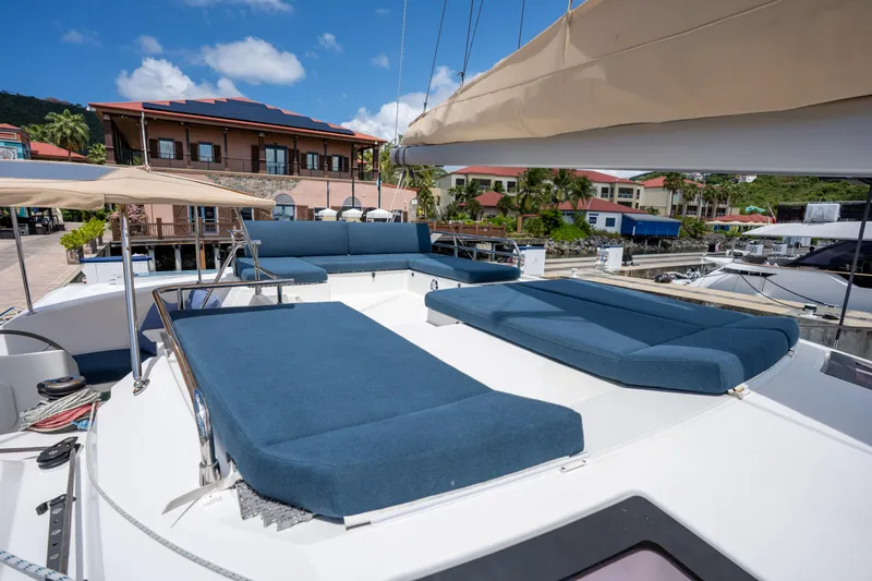  Yacht Photos Pics Luxurious 2020 Fountaine Pajot SABA 50 catamaran with spacious deck and blue sun loungers.