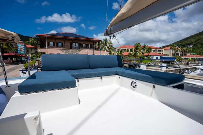  Yacht Photos Pics Luxurious seating area on 2020 Fountaine Pajot SABA 50 catamaran, docked at marina.