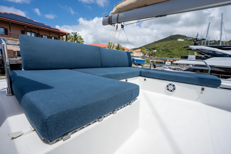  Yacht Photos Pics Fountaine Pajot SABA 50 yacht, 2020 model, featuring blue outdoor seating under a sunny sky.