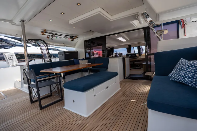  Yacht Photos Pics Spacious interior of 2020 Fountaine Pajot SABA 50 catamaran with elegant seating and dining area.