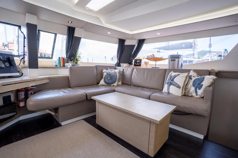  Yacht Photos Pics Luxurious interior of 2020 Fountaine Pajot SABA 50 yacht with plush seating and nautical decor.