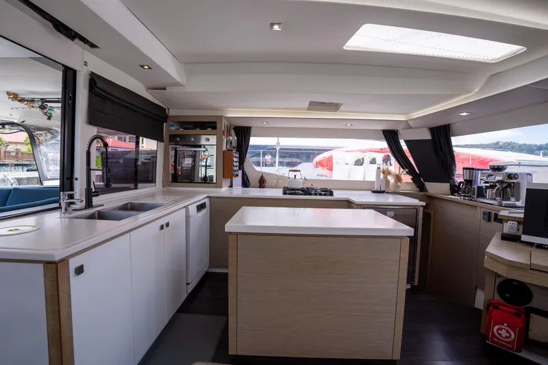  Yacht Photos Pics Modern kitchen interior of 2020 Fountaine Pajot SABA 50 catamaran with sleek design.