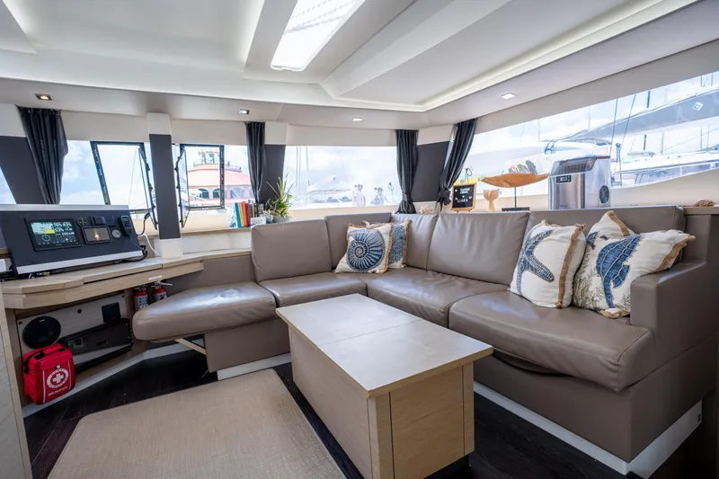  Yacht Photos Pics Luxurious interior of 2020 Fountaine Pajot SABA 50 catamaran with modern seating and decor.