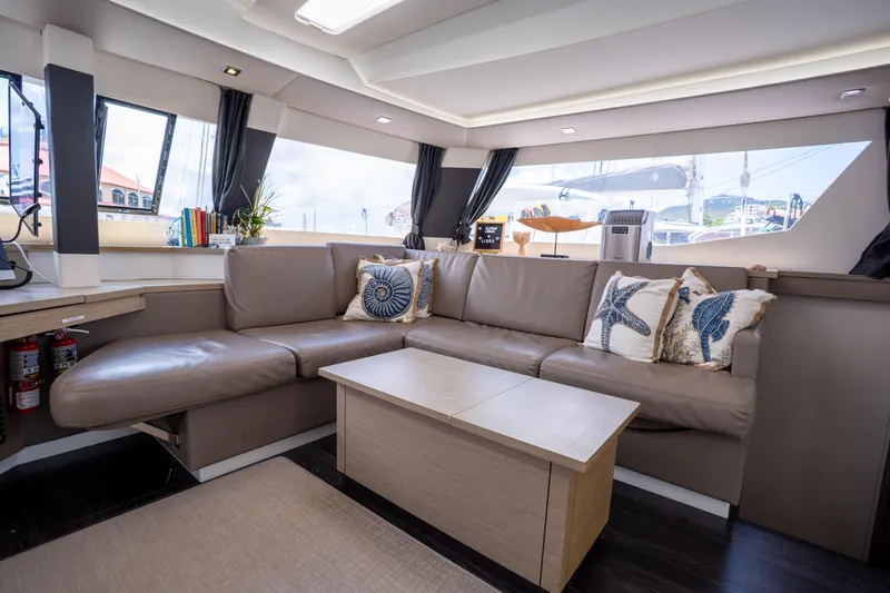  Yacht Photos Pics Luxurious interior of 2020 Fountaine Pajot SABA 50 catamaran with elegant seating and decor.