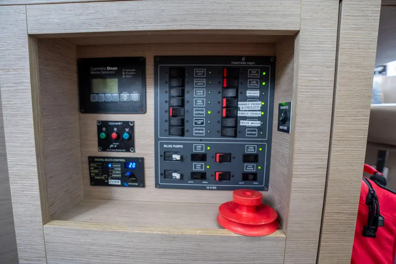  Yacht Photos Pics Control panel of a 2020 Fountaine Pajot SABA 50 catamaran, featuring various switches and gauges.
