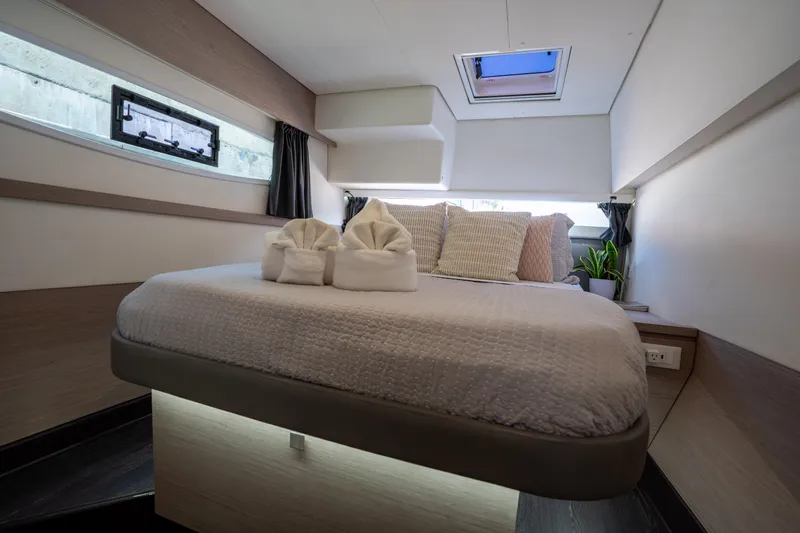  Yacht Photos Pics Luxurious cabin interior of 2020 Fountaine Pajot SABA 50 catamaran with modern bedding.