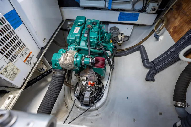  Yacht Photos Pics Engine room of 2020 Fountaine Pajot SABA 50 catamaran, featuring a green marine engine.