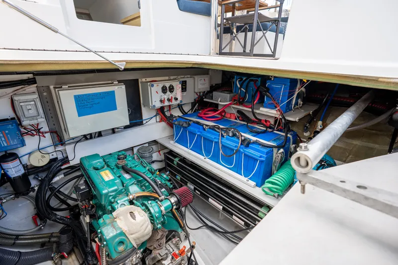  Yacht Photos Pics Engine room of 2020 Fountaine Pajot SABA 50 catamaran with visible machinery and wiring.