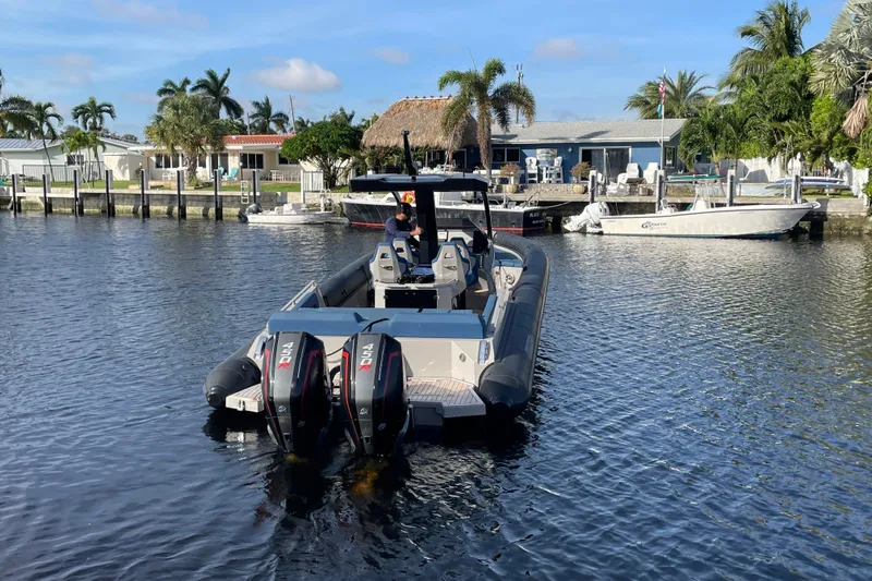  Yacht Photos Pics 2023 Skipper-BSK BSK 38 boat with dual engines on a sunny waterfront.