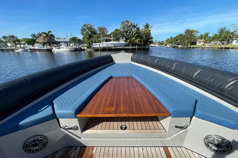  Yacht Photos Pics Luxurious Skipper-BSK 38 boat interior with blue seating and wooden table, 2023 model.