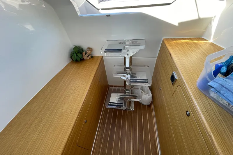 Yacht Photos Pics Modern interior of 2023 Skipper-BSK BSK 38 boat with wooden flooring and compact storage.