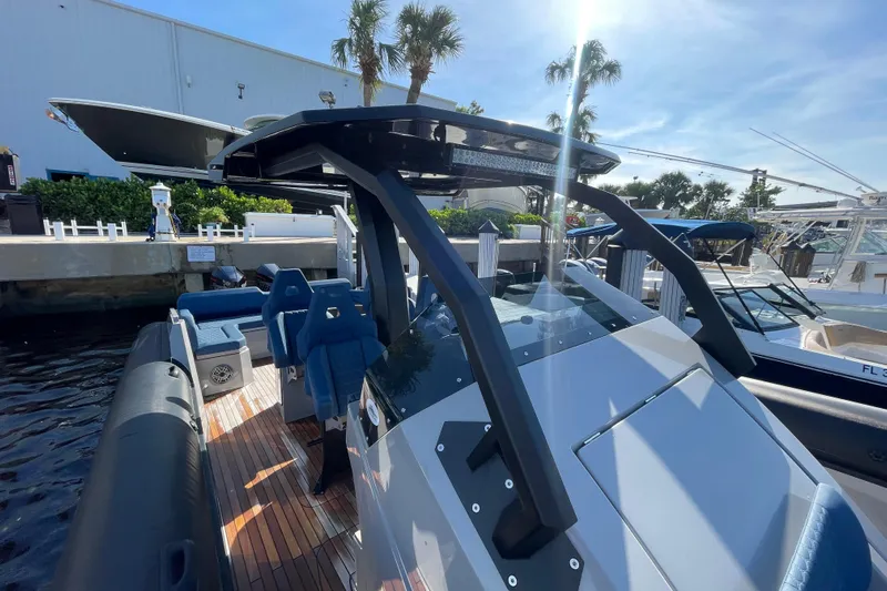  Yacht Photos Pics 2023 Skipper-BSK BSK 38 boat docked, featuring sleek design and modern seating.