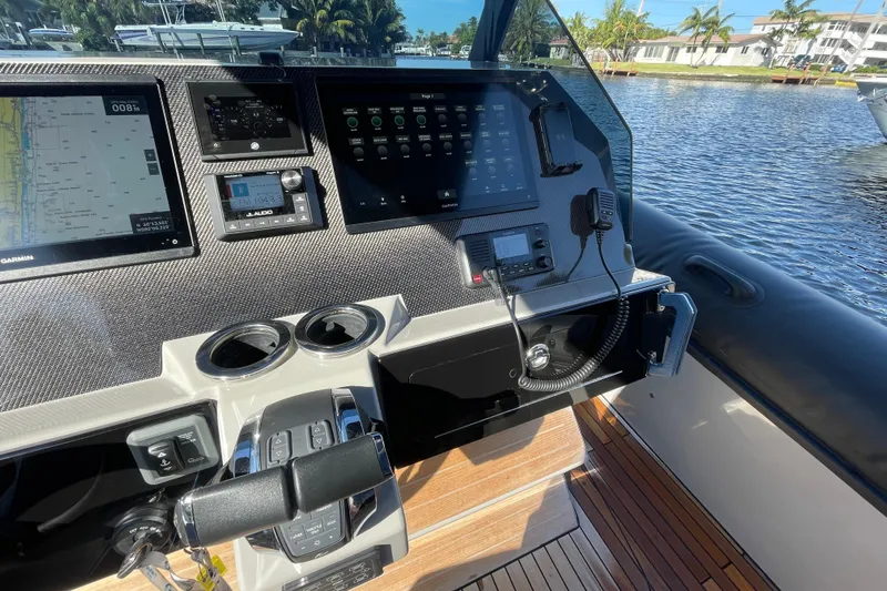 Yacht Photos Pics 2023 Skipper-BSK BSK 38 boat dashboard with navigation and control systems.