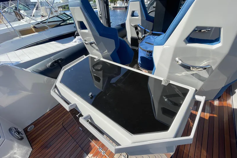  Yacht Photos Pics 2023 Skipper-BSK BSK 38 boat interior with sleek seating and modern table design.