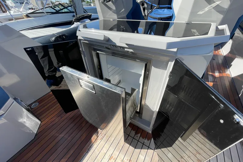  Yacht Photos Pics 2023 Skipper-BSK BSK 38 yacht interior with open storage compartments on wooden deck.