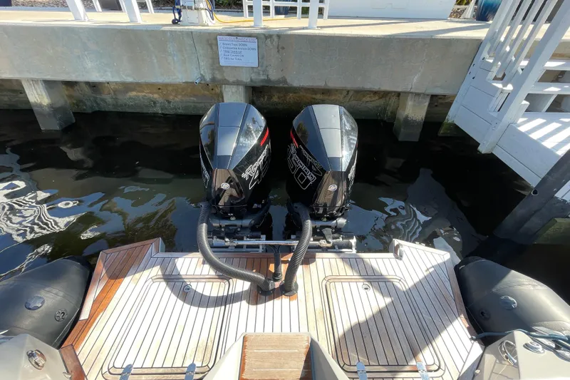  Yacht Photos Pics Twin outboard motors on a 2023 Skipper-BSK BSK 38 boat at a dock.
