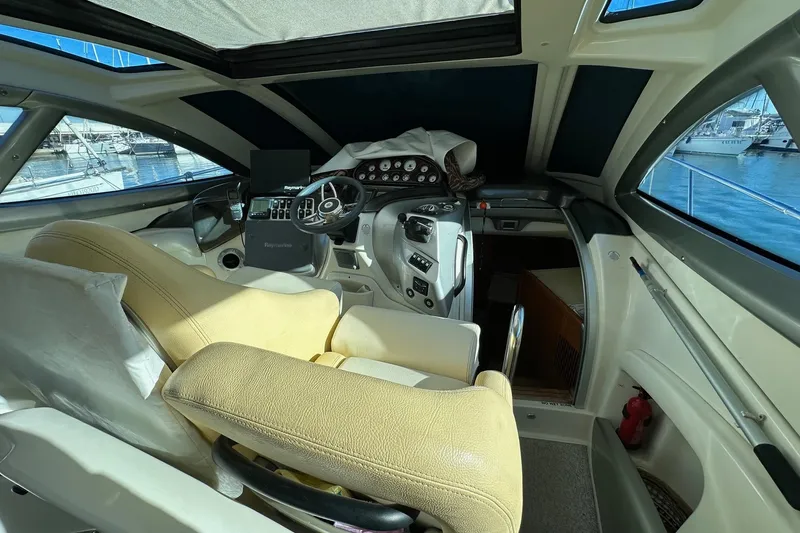  Yacht Photos Pics Interior of 2006 Cranchi Mediterranee 47 HT yacht with helm and seating area.