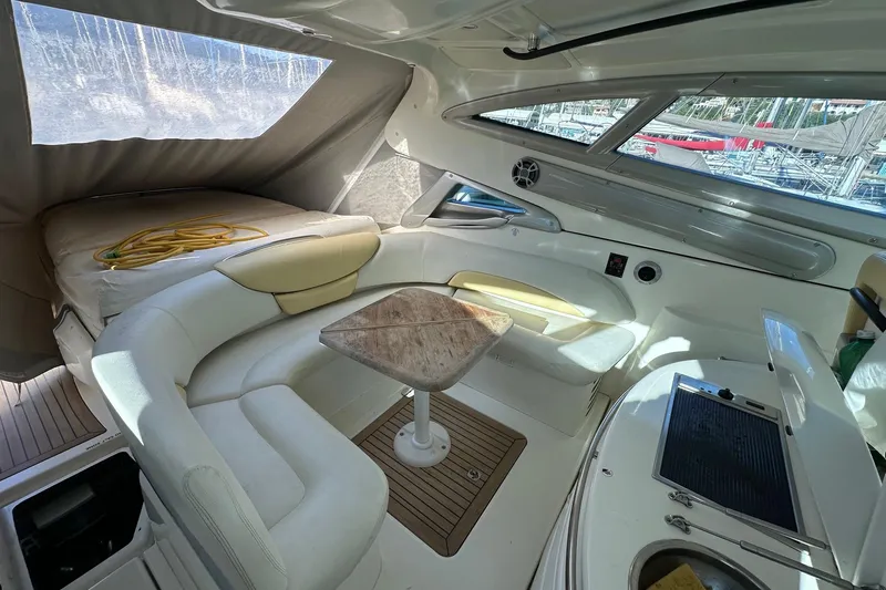  Yacht Photos Pics Interior of 2006 Cranchi Mediterranee 47 HT yacht with seating and table.