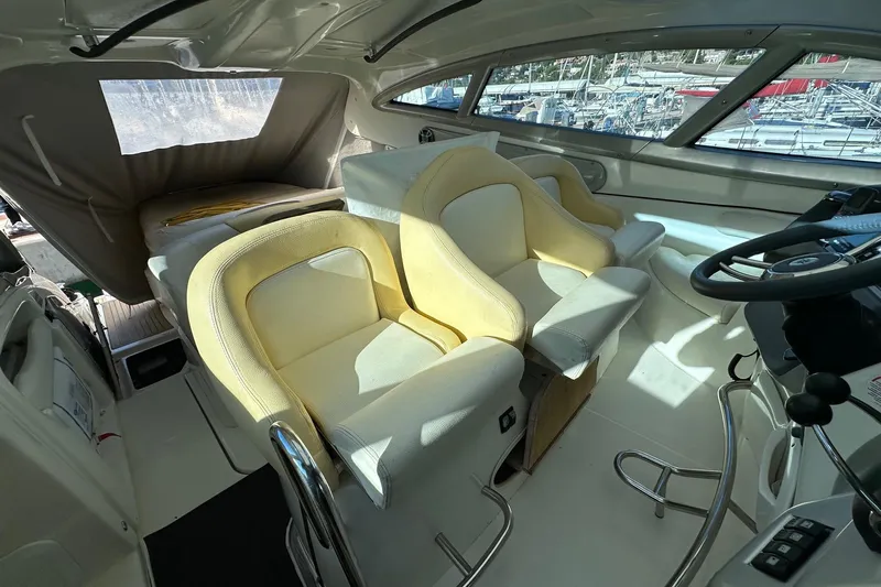  Yacht Photos Pics Interior of 2006 Cranchi Mediterranee 47 HT yacht with helm and seating area.