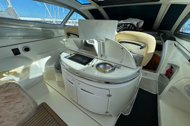  Yacht Photos Pics Interior of 2006 Cranchi Mediterranee 47 HT yacht with modern amenities and seating.