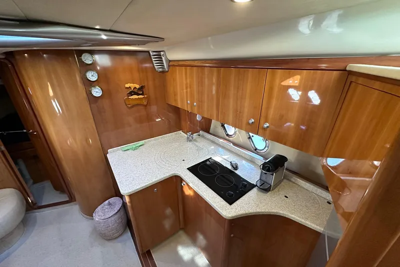  Yacht Photos Pics Luxurious kitchen interior of 2006 Cranchi Mediterranee 47 HT yacht with modern amenities.