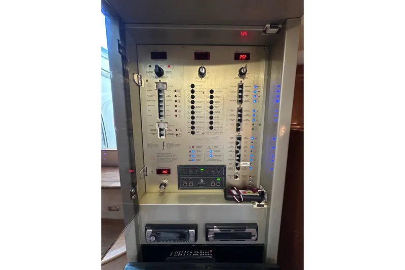  Yacht Photos Pics Electrical control panel inside 2006 Cranchi Mediterranee 47 HT yacht, featuring switches and indicators.