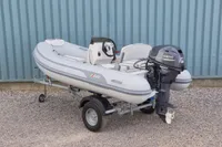 2024 AB Inflatables 10 ALX boat with Yamaha engine on trailer.