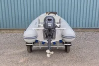 2024 AB Inflatables 10 ALX boat with Yamaha 25HP engine on trailer.