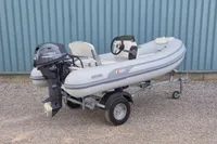 2024 AB Inflatables 10 ALX boat with Yamaha engine on a trailer.
