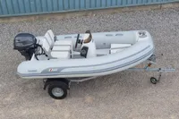 2024 AB Inflatables 10 ALX boat on trailer with Yamaha outboard motor.