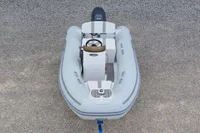 2024 AB Inflatables 10 ALX boat, top view, on gravel surface.