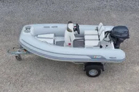 2024 AB Inflatables 10 ALX boat on trailer, featuring Yamaha outboard motor.
